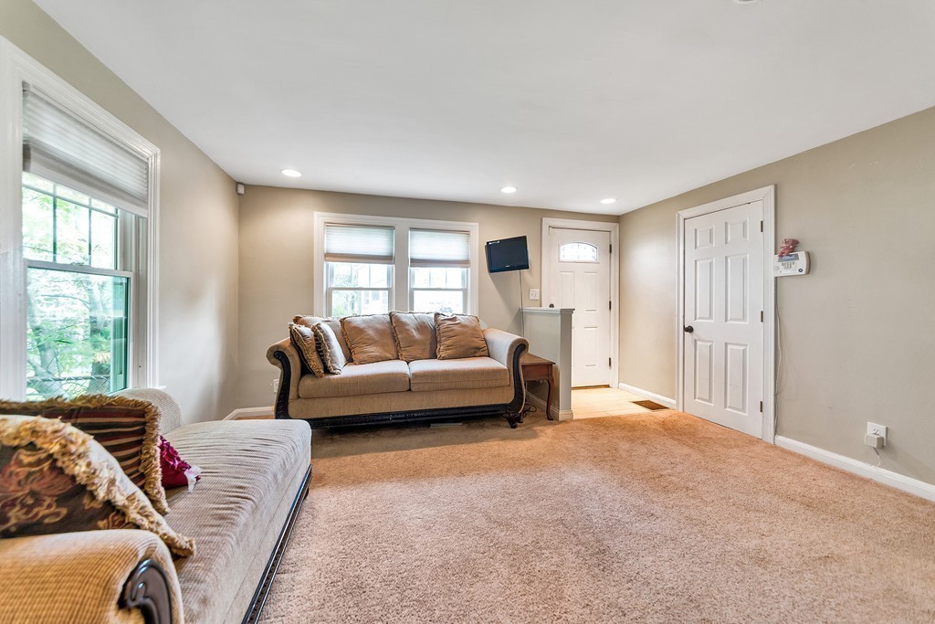 48 Drexel Street Springfield, MA 01104 - Photo 4 of 24 a living room with furniture and a large window