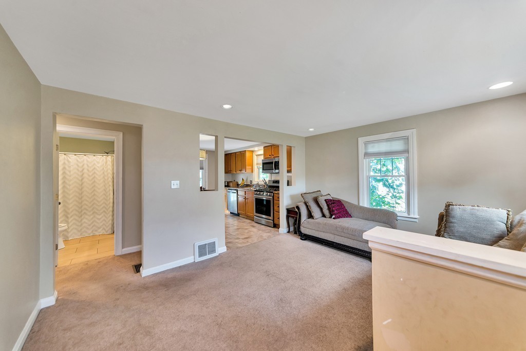 48 Drexel Street Springfield, MA 01104 - Photo 5 of 24 a living room with furniture and a window
