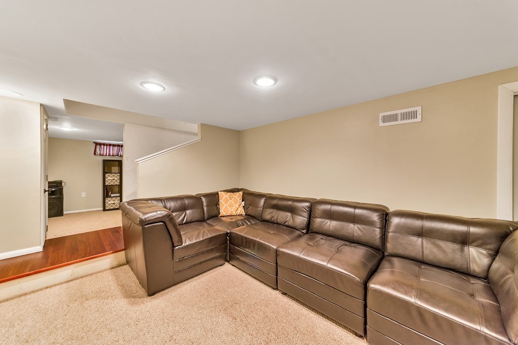 48 Drexel Street Springfield, MA 01104 - Photo 8 of 24 a living room with furniture and a couch