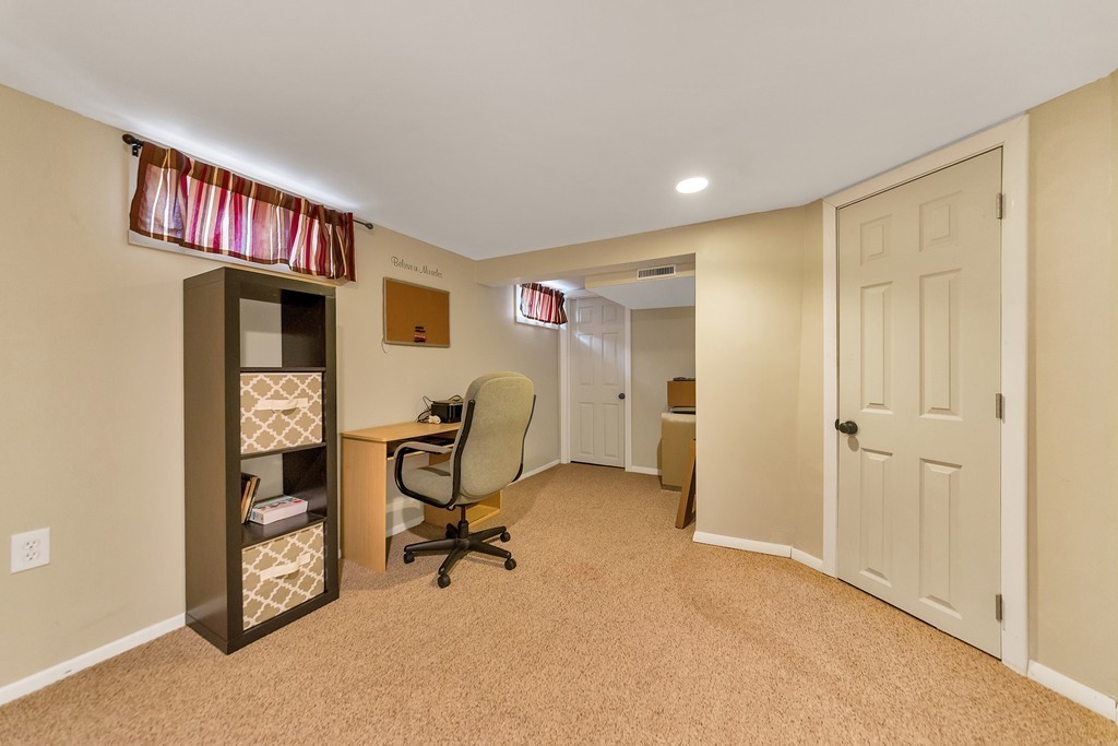 48 Drexel Street Springfield, MA 01104 - Photo 9 of 24 a view of a workspace with furniture and a window
