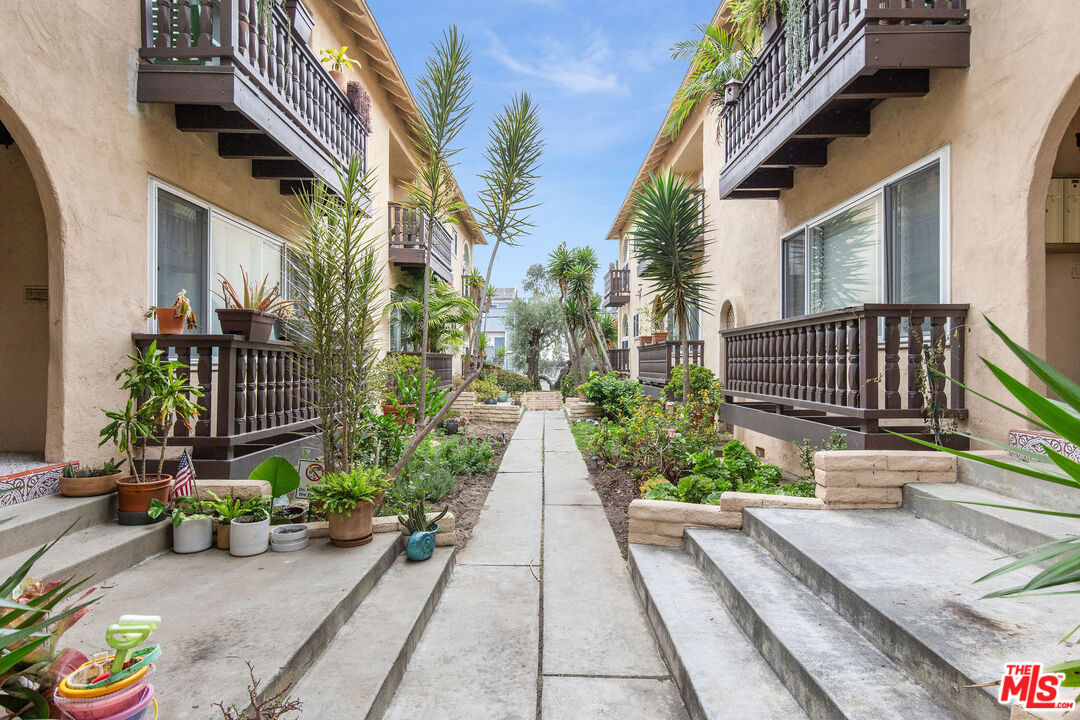 8155 Manitoba Street, Unit 12 Playa del Rey, CA 90293 - Photo 14 of 16 a view of path along with potted plants