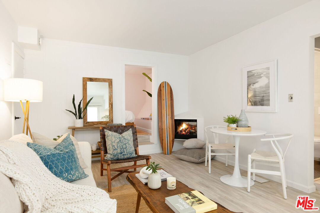8155 Manitoba Street, Unit 12 Playa del Rey, CA 90293 - Photo 2 of 16 a living room with furniture and wooden floor