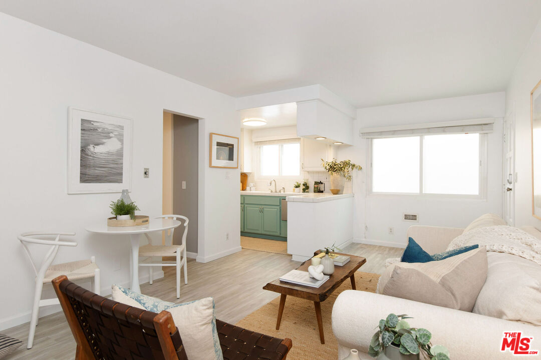 8155 Manitoba Street, Unit 12 Playa del Rey, CA 90293 - Photo 3 of 16 a living room with furniture kitchen and a window