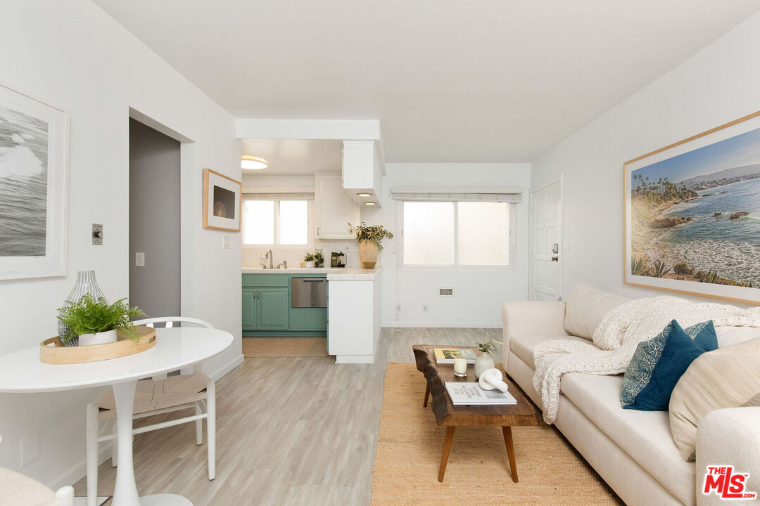8155 Manitoba Street, Unit 12 Playa del Rey, CA 90293 - Photo 5 of 16 a living room with furniture and a large window