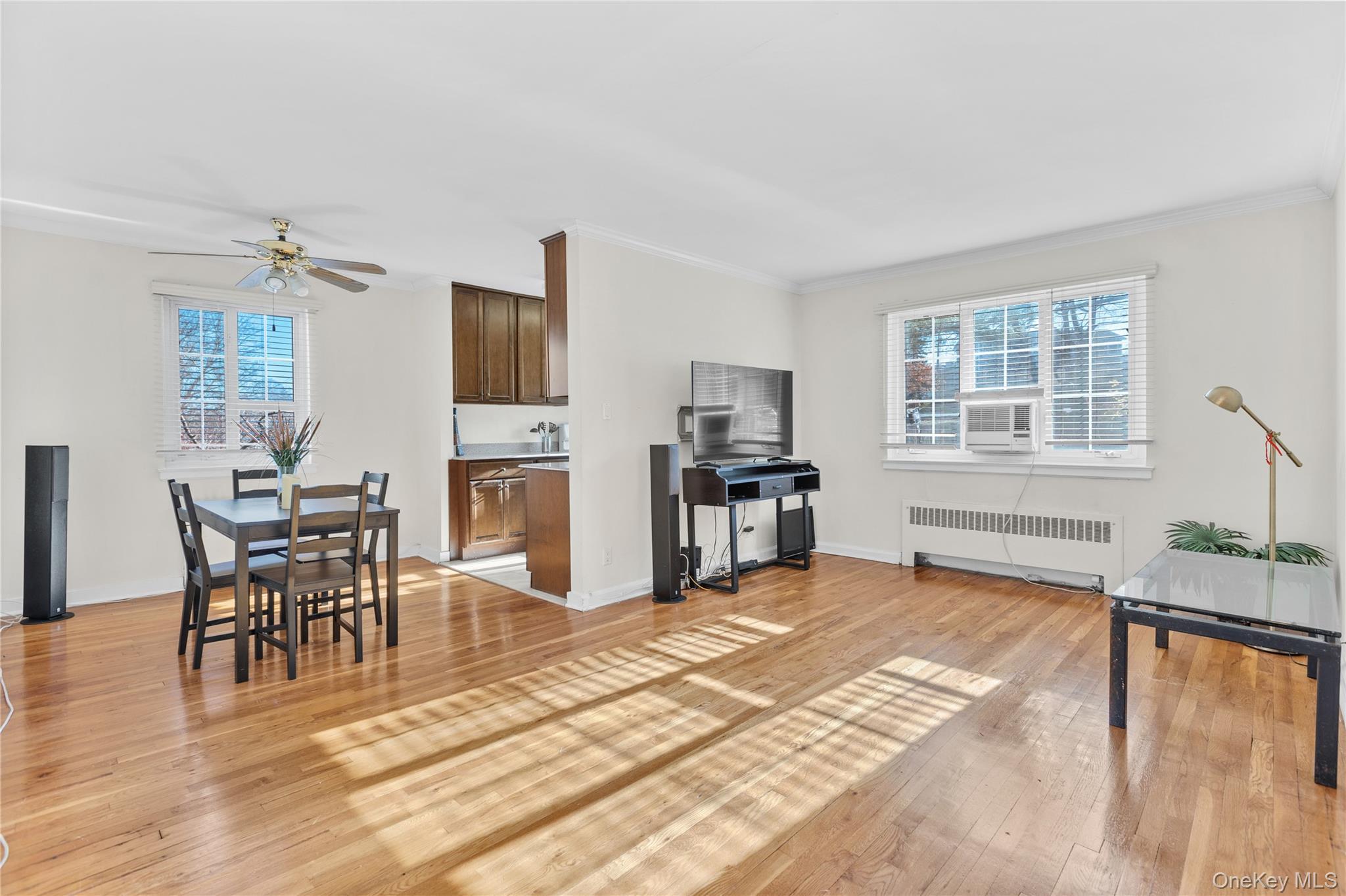 425 Main Street, Unit 92A Huntington, NY 11743 - Photo 3 of 13 a view of a livingroom with furniture window and wooden floor