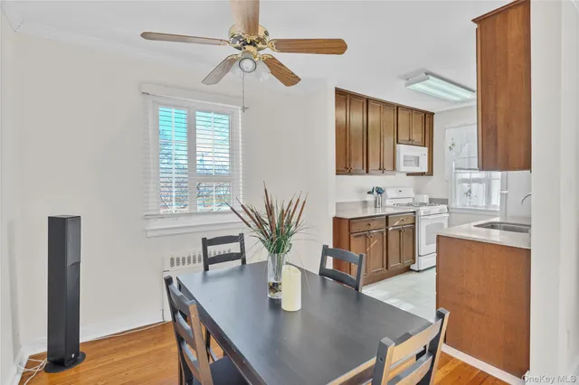 a view of kitchen with sink and wooden floor