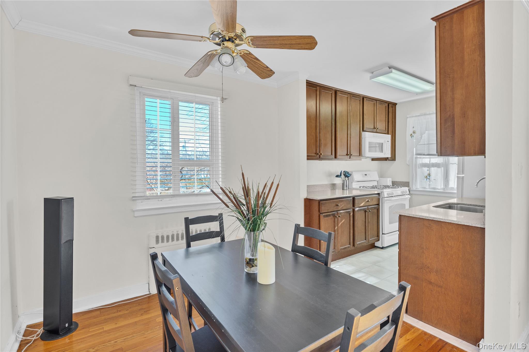 425 Main Street, Unit 92A Huntington, NY 11743 - Photo 5 of 13 a view of kitchen with sink and wooden floor