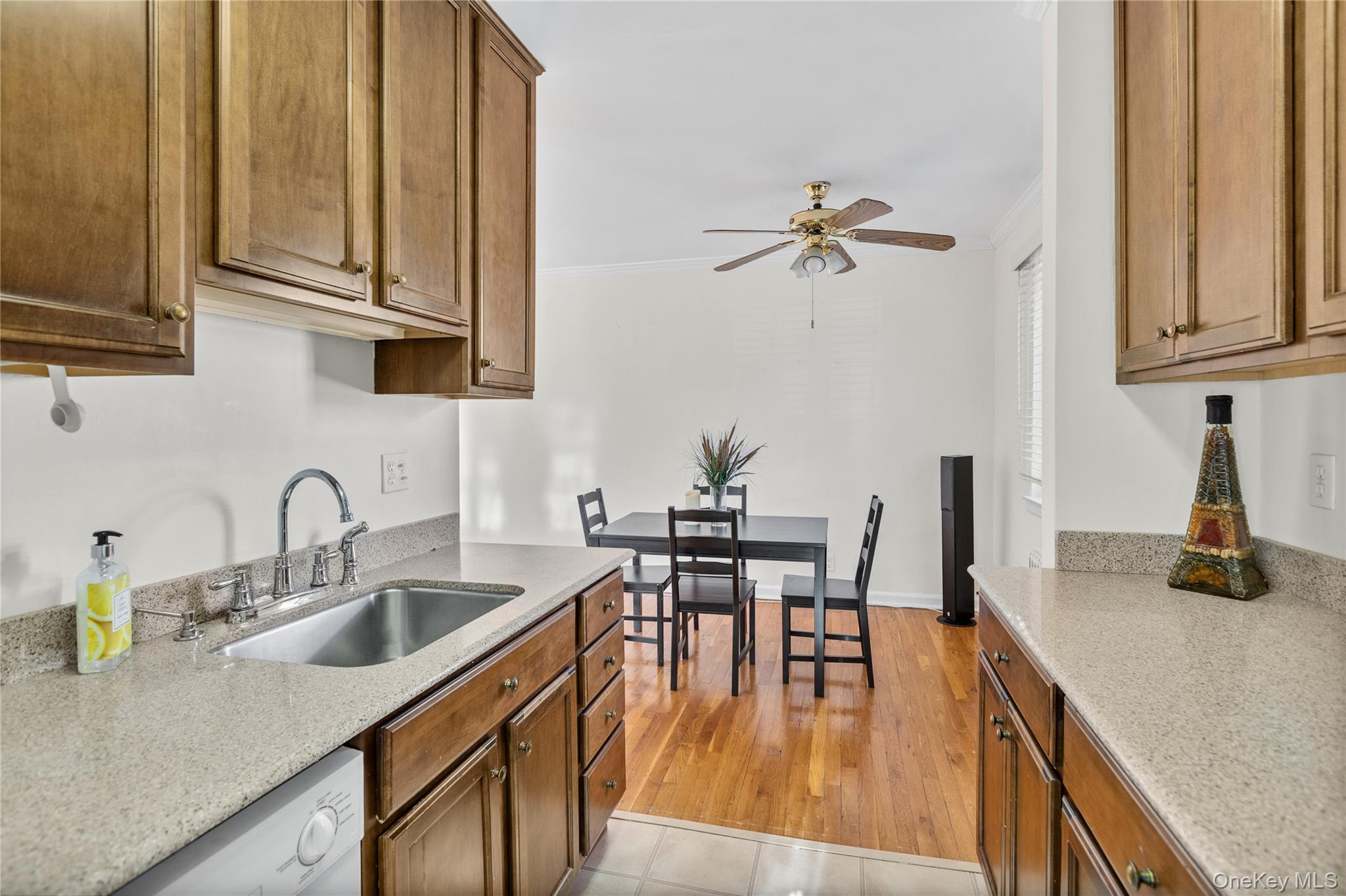 425 Main Street, Unit 92A Huntington, NY 11743 - Photo 6 of 13 a kitchen with stainless steel appliances granite countertop a sink a stove and island