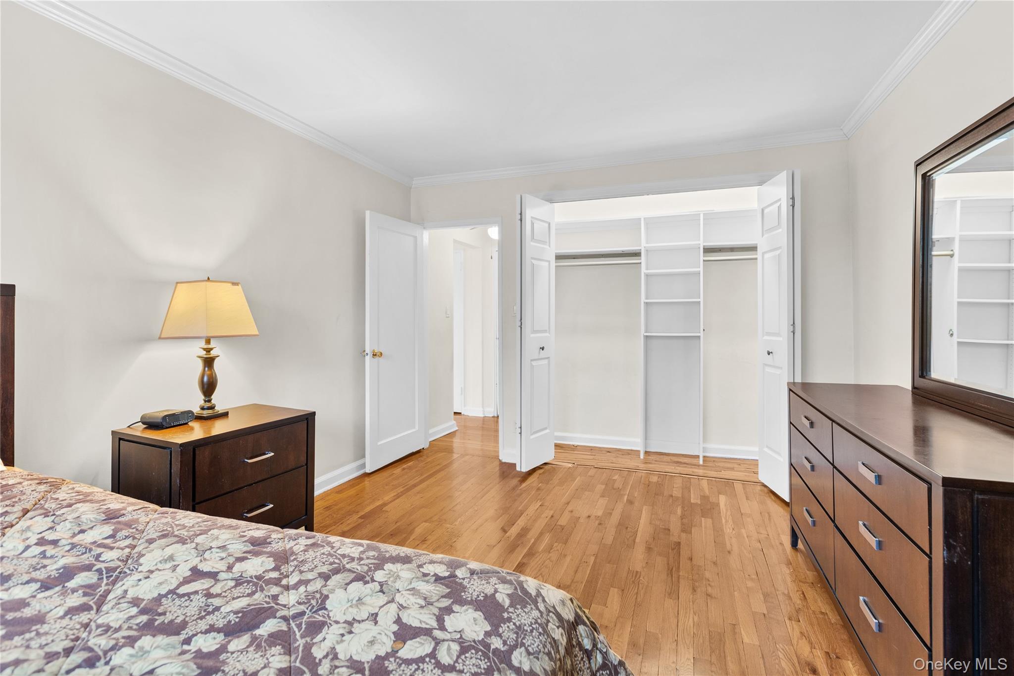 425 Main Street, Unit 92A Huntington, NY 11743 - Photo 9 of 13 a bedroom with a bed and a dresser