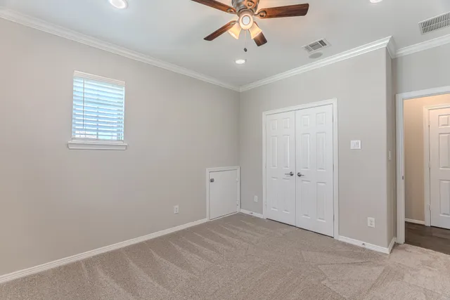 a bathroom with a granite countertop bathtub shower sink vanity and toilet