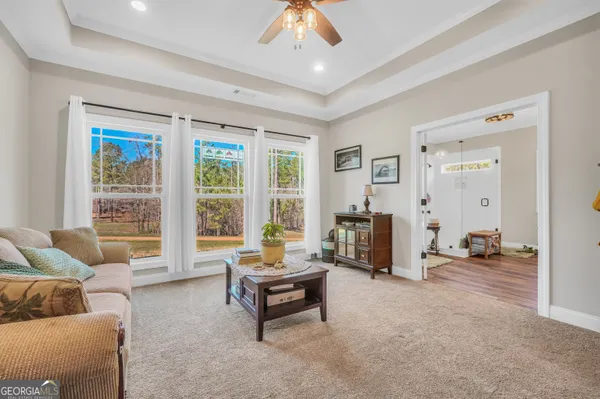 a living room with furniture and a large window