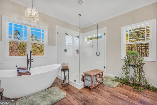 a hall with cabinets and wooden floor