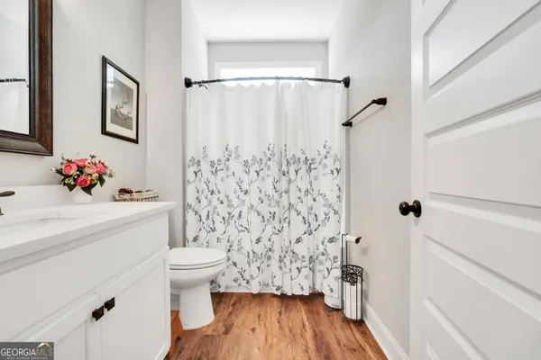 a bedroom with baby bed and a window