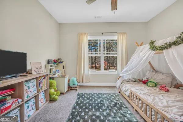 a bathroom with a toilet sink and a mirror