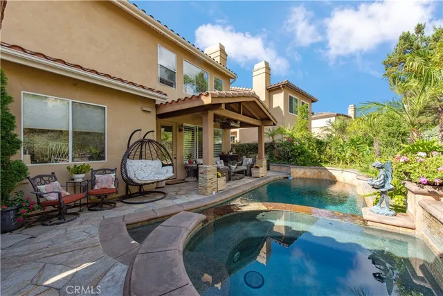 a view of a swimming pool with a patio