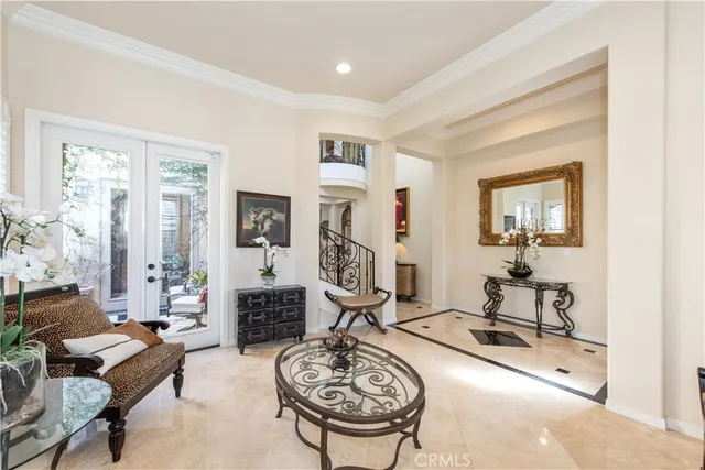 a room with furniture a chandelier and a window