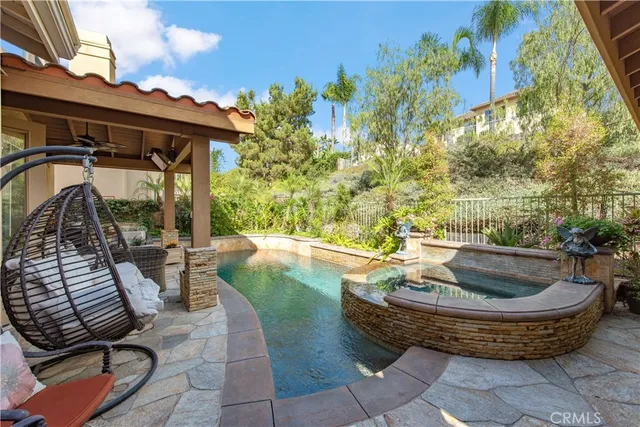 a view of swimming pool with lounge chair