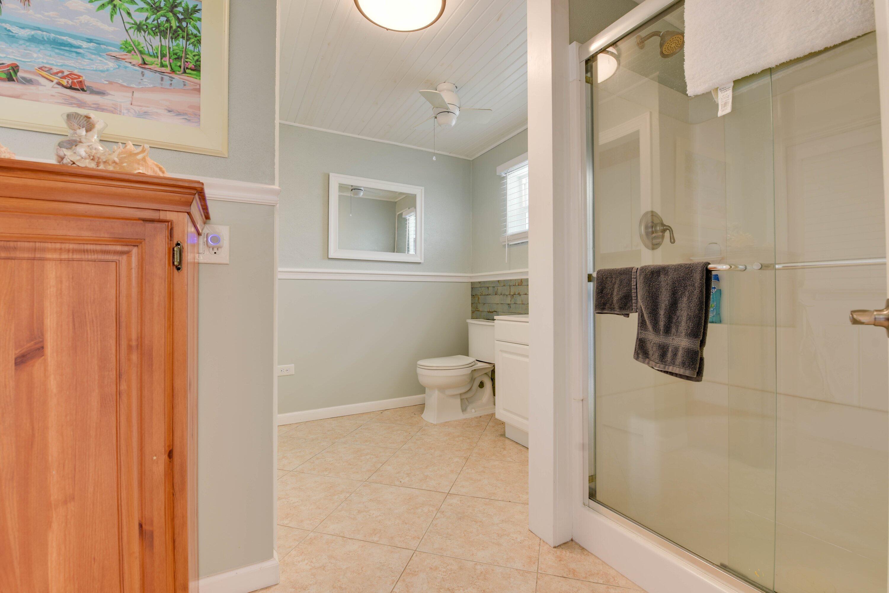 1567 Watson Boulevard Big Pine Key, FL 33043 - Photo 13 of 57 a bathroom with a toilet sink and shower