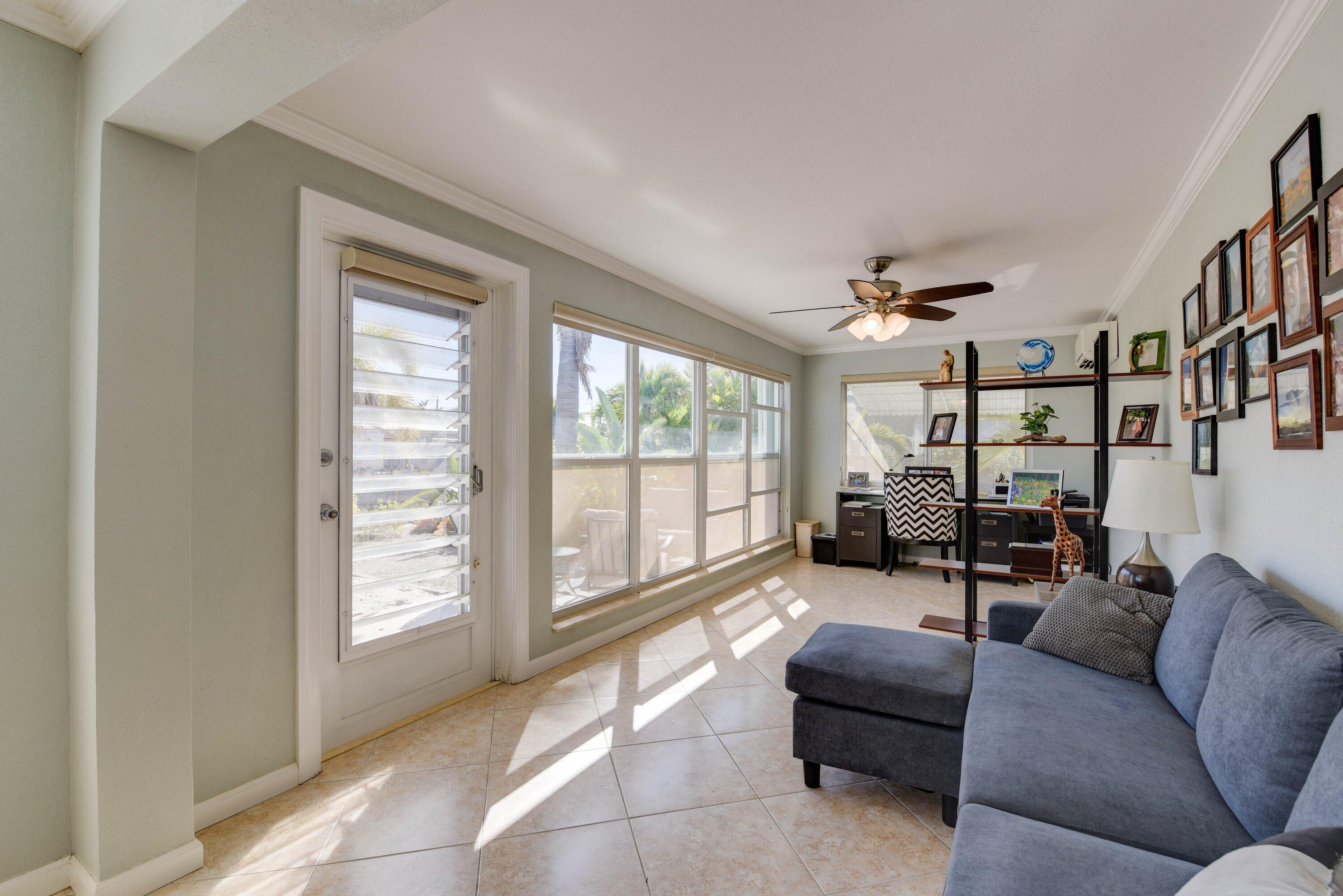 1567 Watson Boulevard Big Pine Key, FL 33043 - Photo 16 of 57 a living room with furniture and a large window
