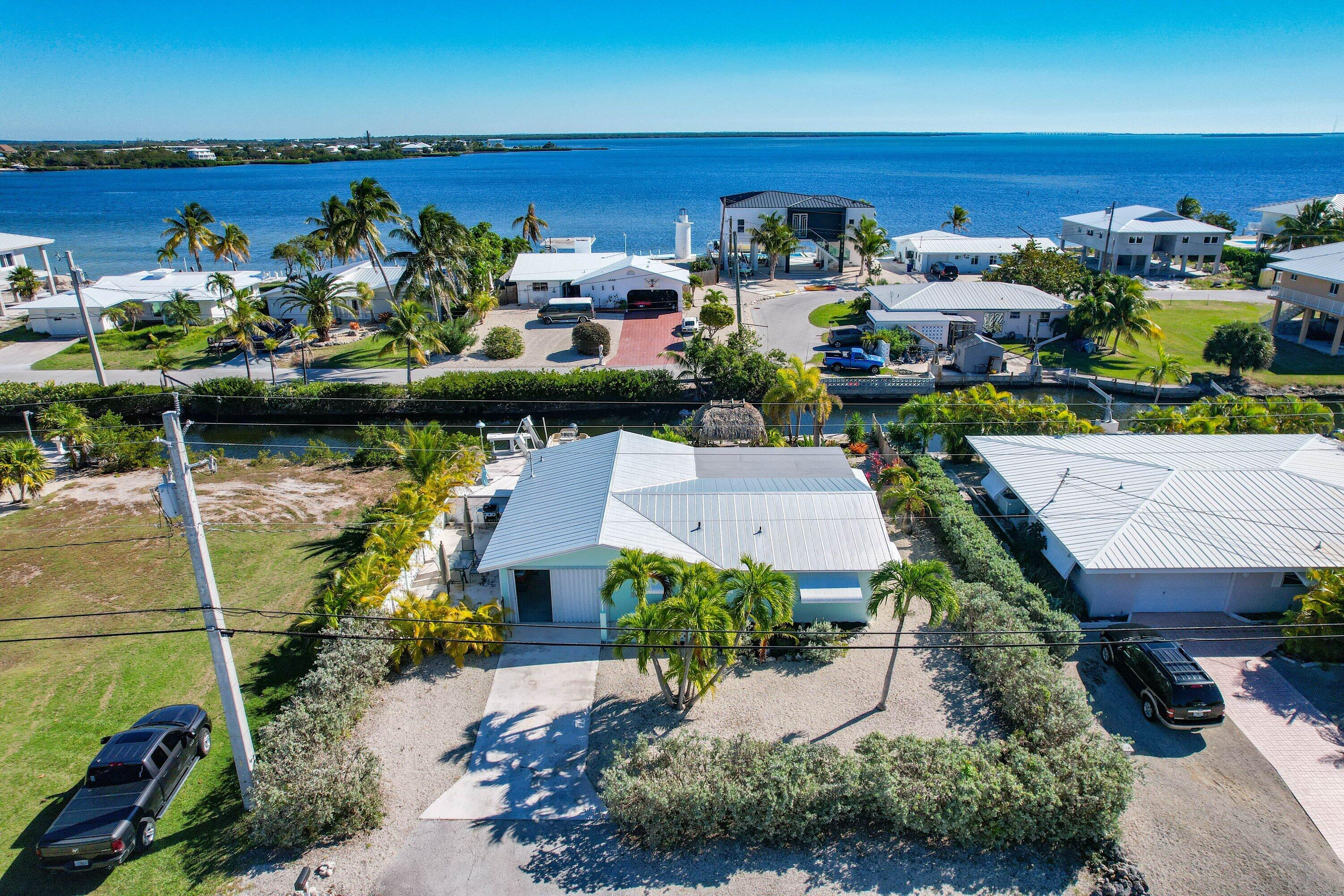 1567 Watson Boulevard Big Pine Key, FL 33043 - Photo 3 of 57 an aerial view of a house with a ocean view
