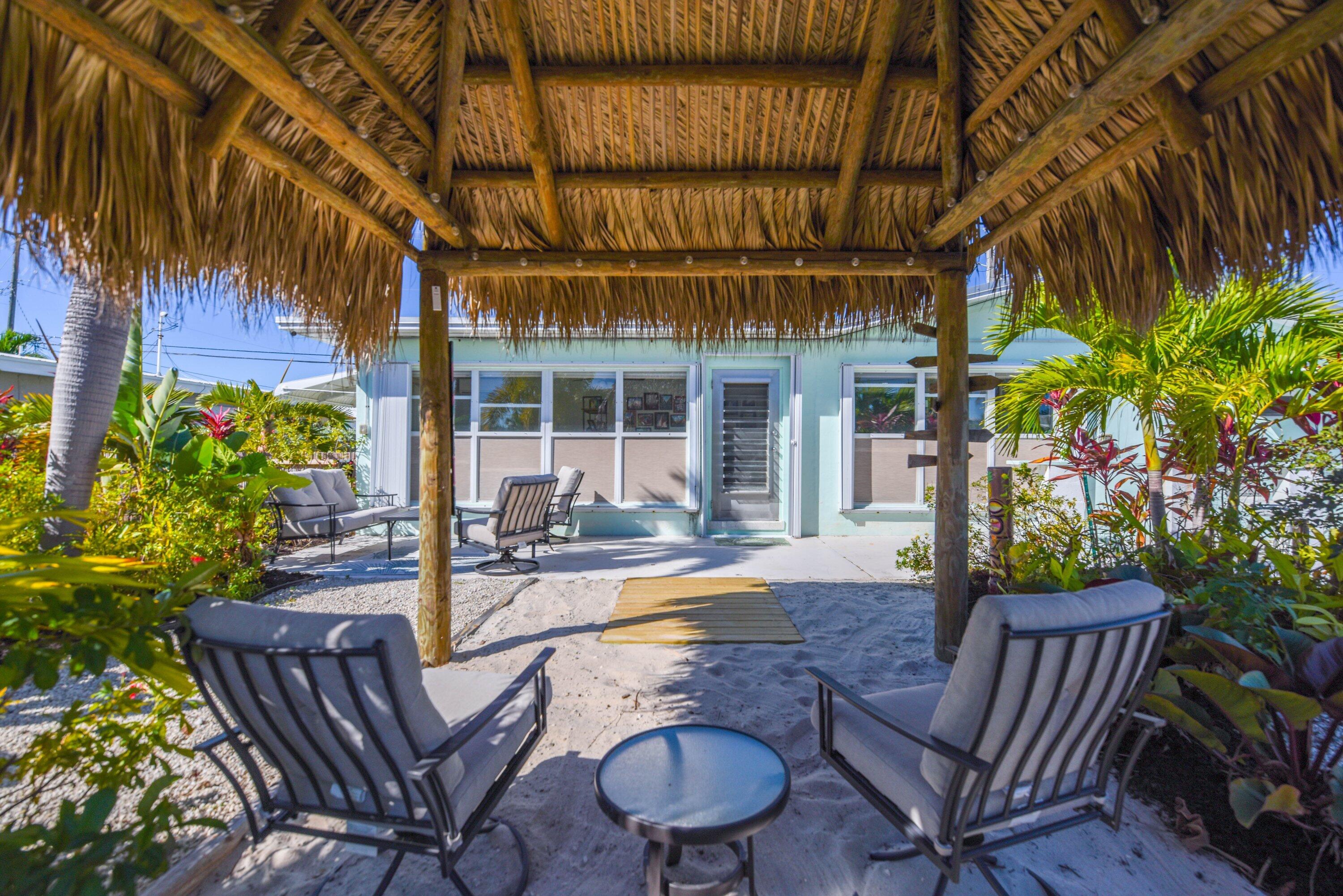 1567 Watson Boulevard Big Pine Key, FL 33043 - Photo 38 of 57 a view of house with backyard and sitting area