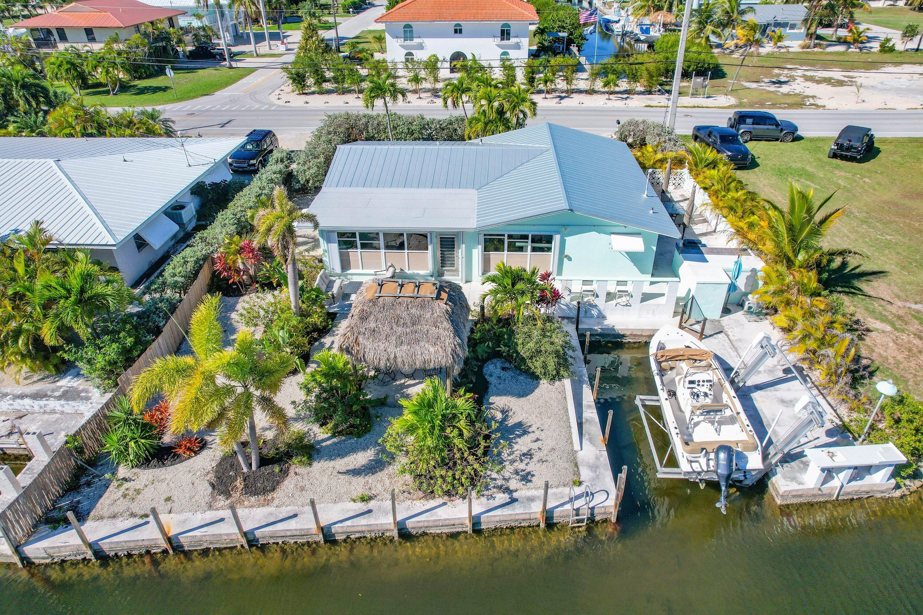 1567 Watson Boulevard Big Pine Key, FL 33043 - Photo 6 of 57 an aerial view of a house with a garden and lake view