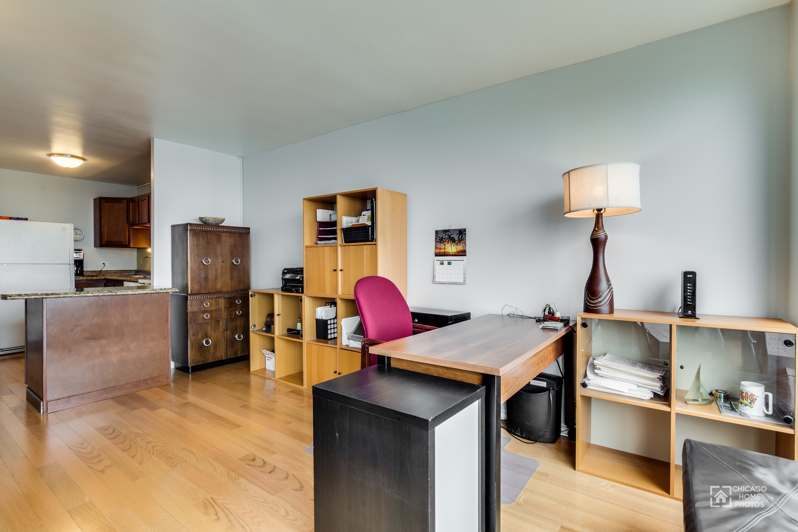 5445 North Sheridan Road, Unit 1809 Chicago, IL 60640 - Photo 5 of 18 a living room with furniture and a flat screen tv