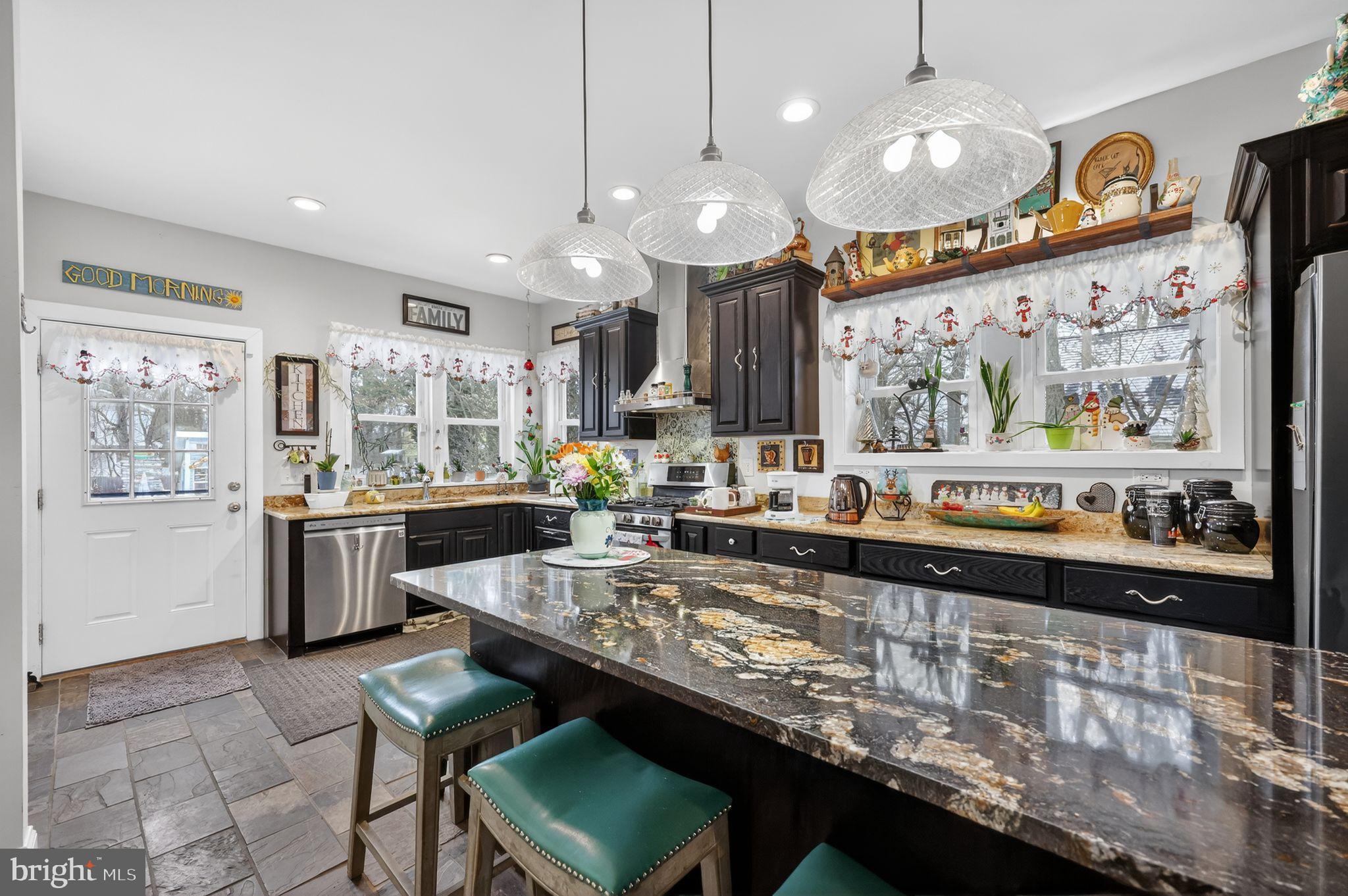 225 Rutland Avenue Mount Holly, NJ 08060 - Photo 12 of 30 a large kitchen with a large counter top appliances and cabinets