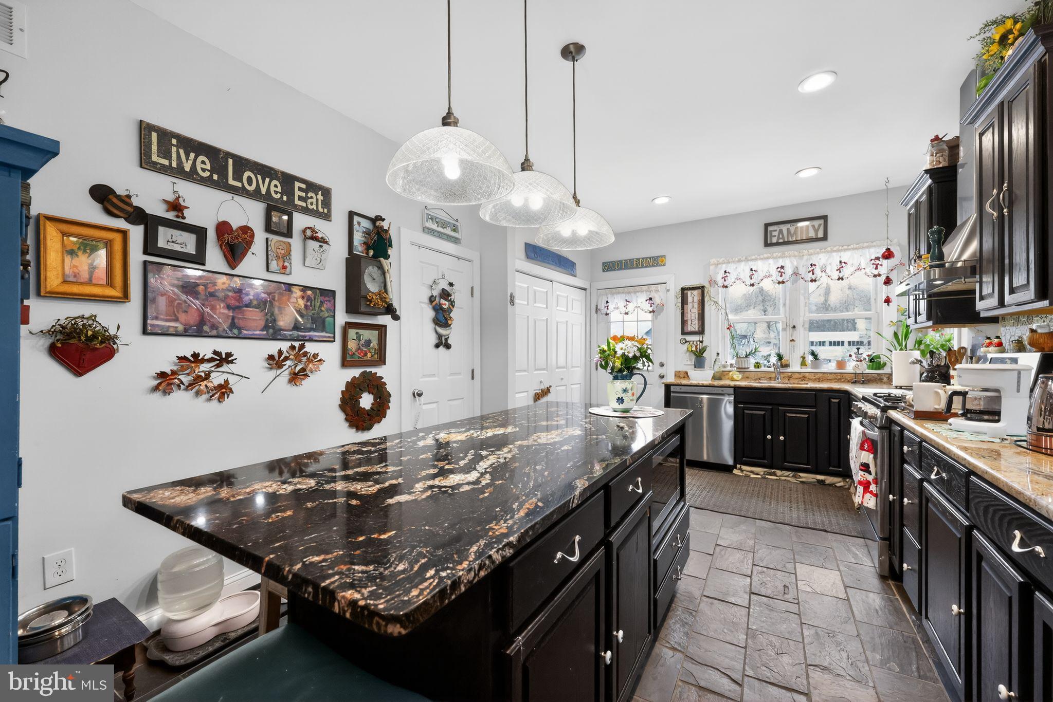 225 Rutland Avenue Mount Holly, NJ 08060 - Photo 14 of 30 a kitchen with stainless steel appliances granite countertop a stove a sink and a refrigerator