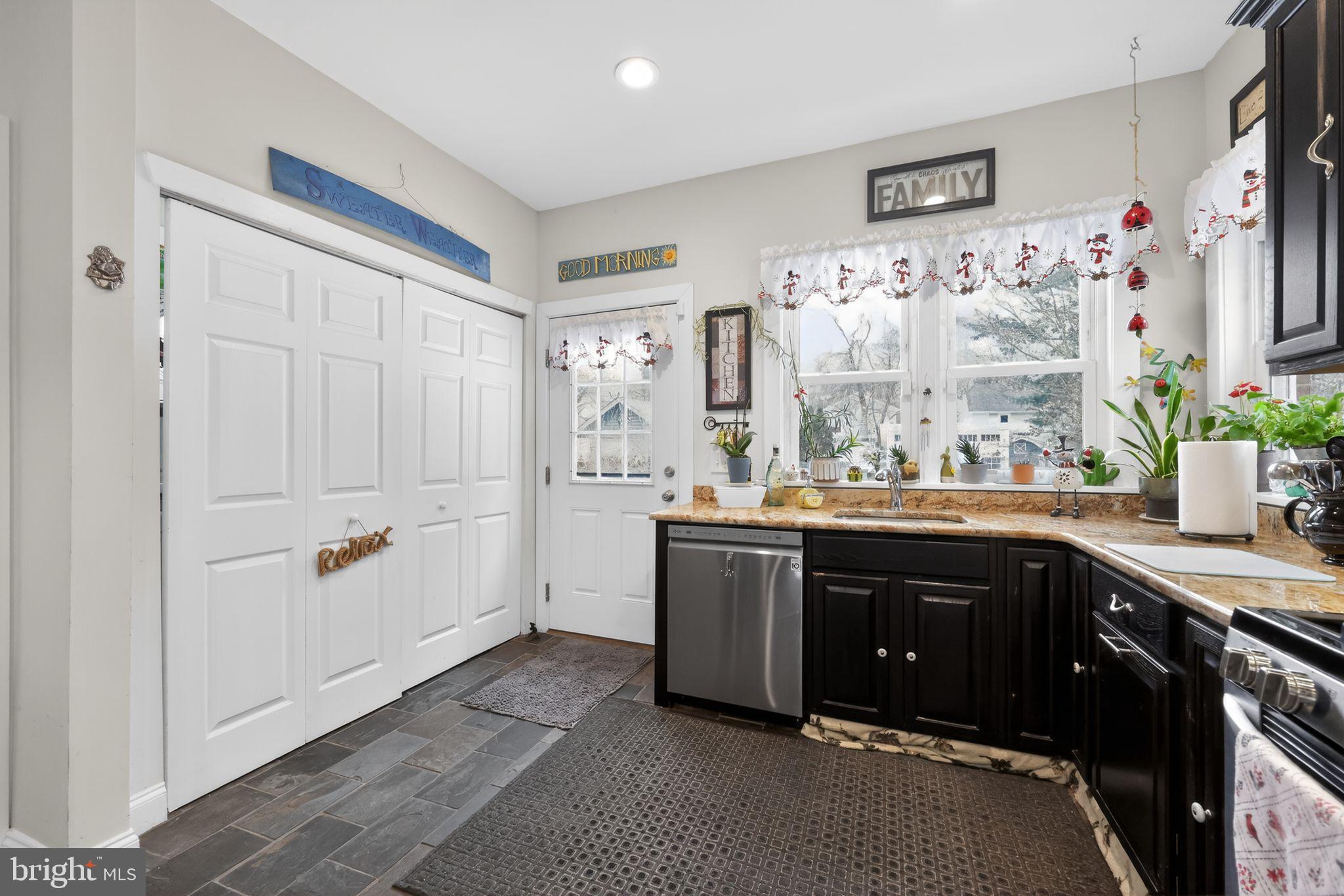 225 Rutland Avenue Mount Holly, NJ 08060 - Photo 15 of 30 a spacious bathroom with a granite countertop sink and a large mirror