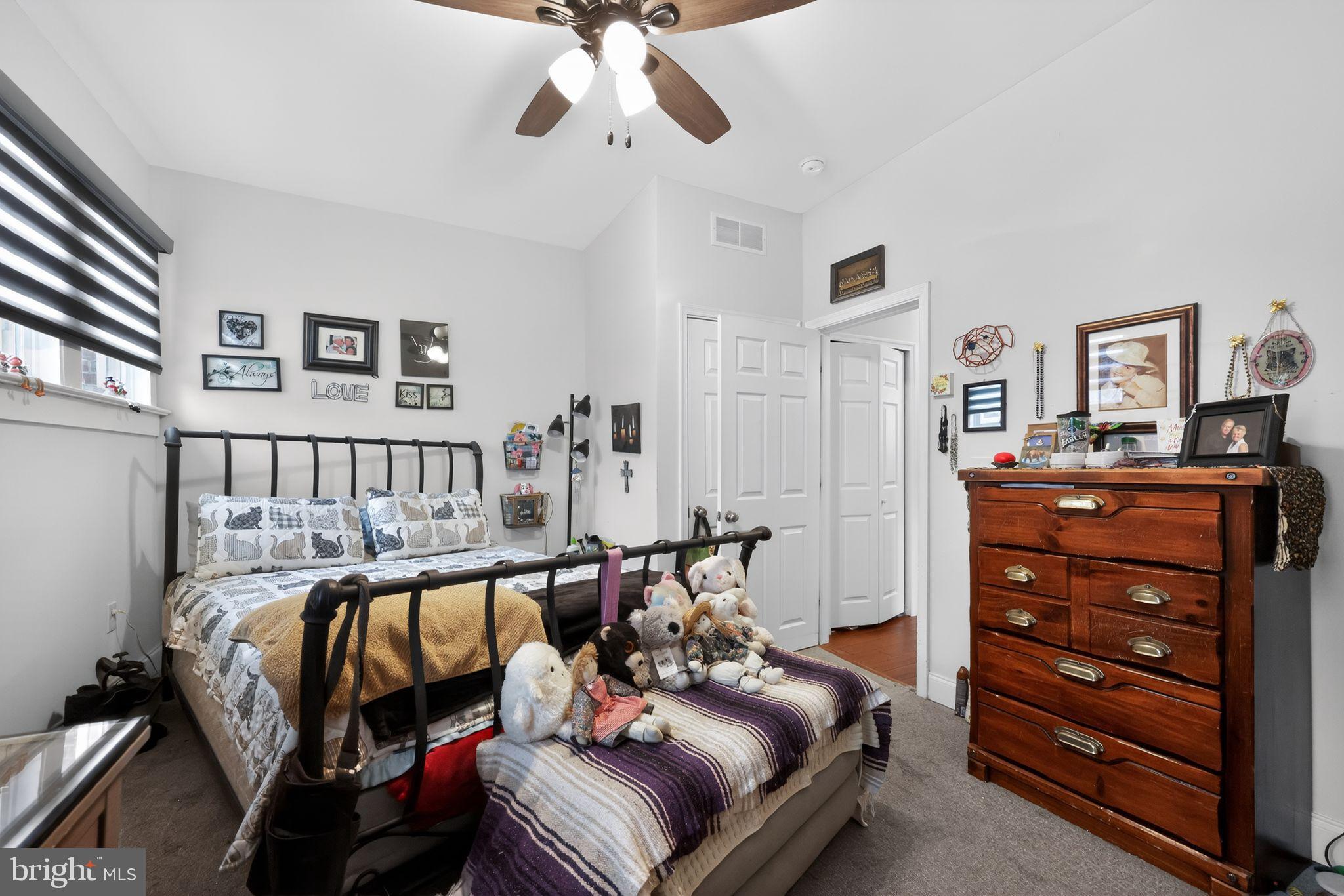 225 Rutland Avenue Mount Holly, NJ 08060 - Photo 19 of 30 a bedroom with furniture and a chandelier
