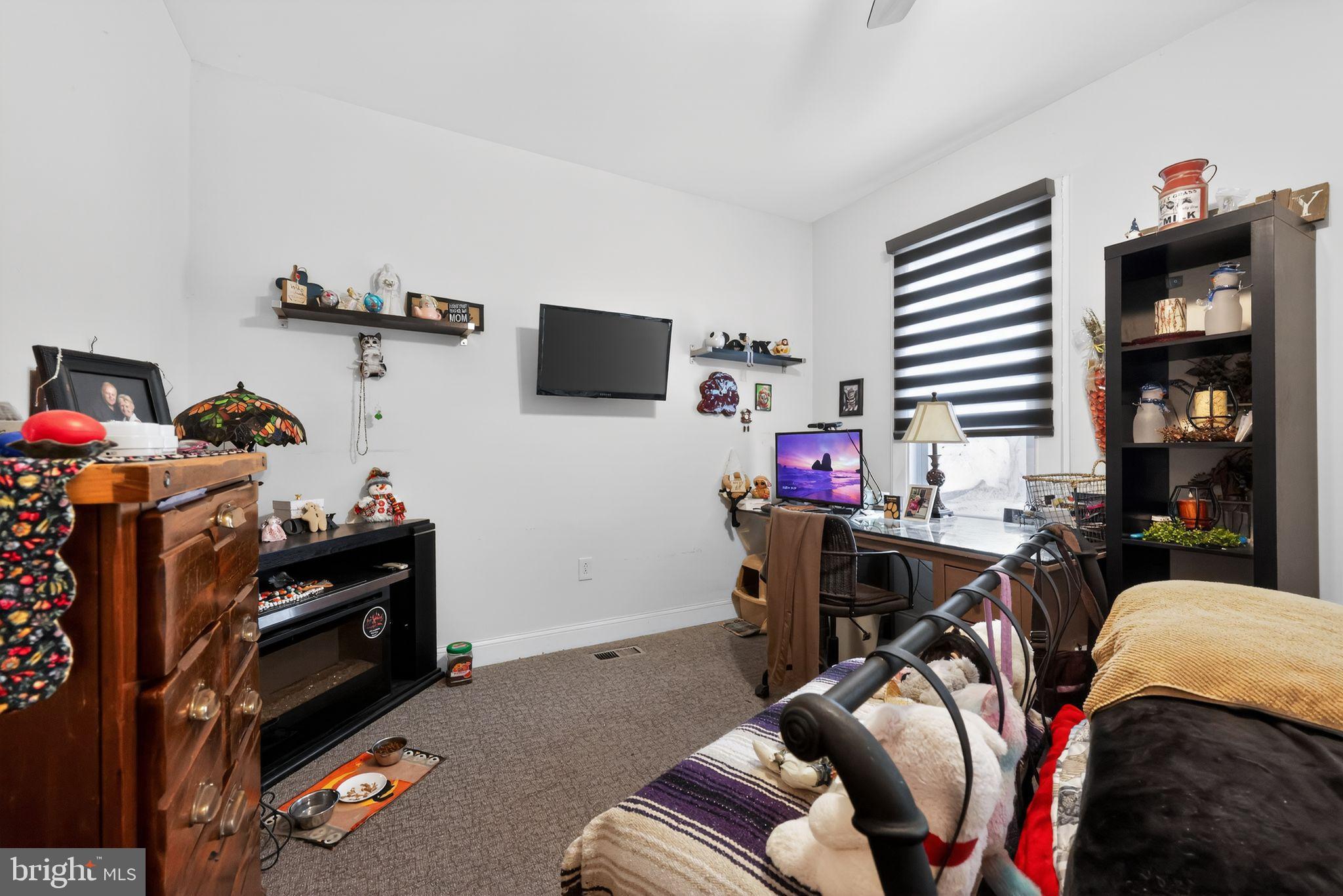 225 Rutland Avenue Mount Holly, NJ 08060 - Photo 20 of 30 a bedroom with furniture and a flat screen tv