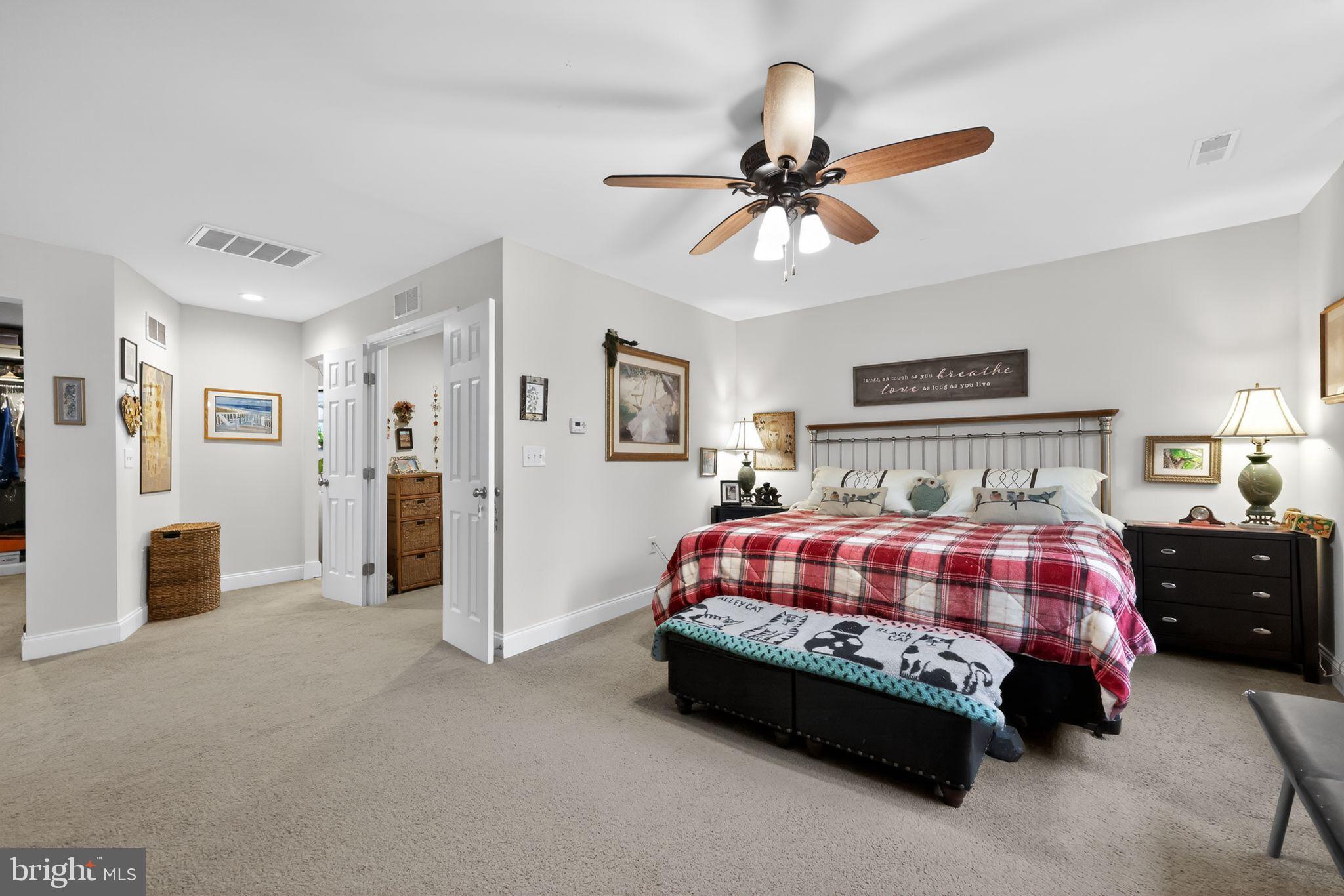 225 Rutland Avenue Mount Holly, NJ 08060 - Photo 21 of 30 a bedroom with a bed and a chandelier