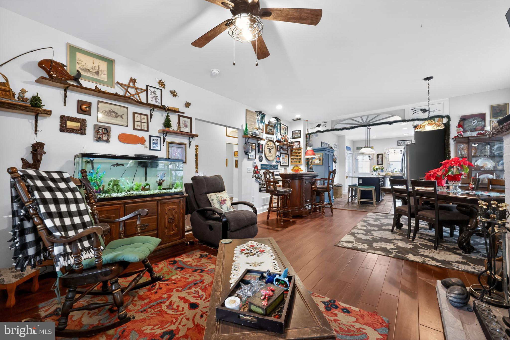 225 Rutland Avenue Mount Holly, NJ 08060 - Photo 7 of 30 a living room with lots of furniture and a chandelier
