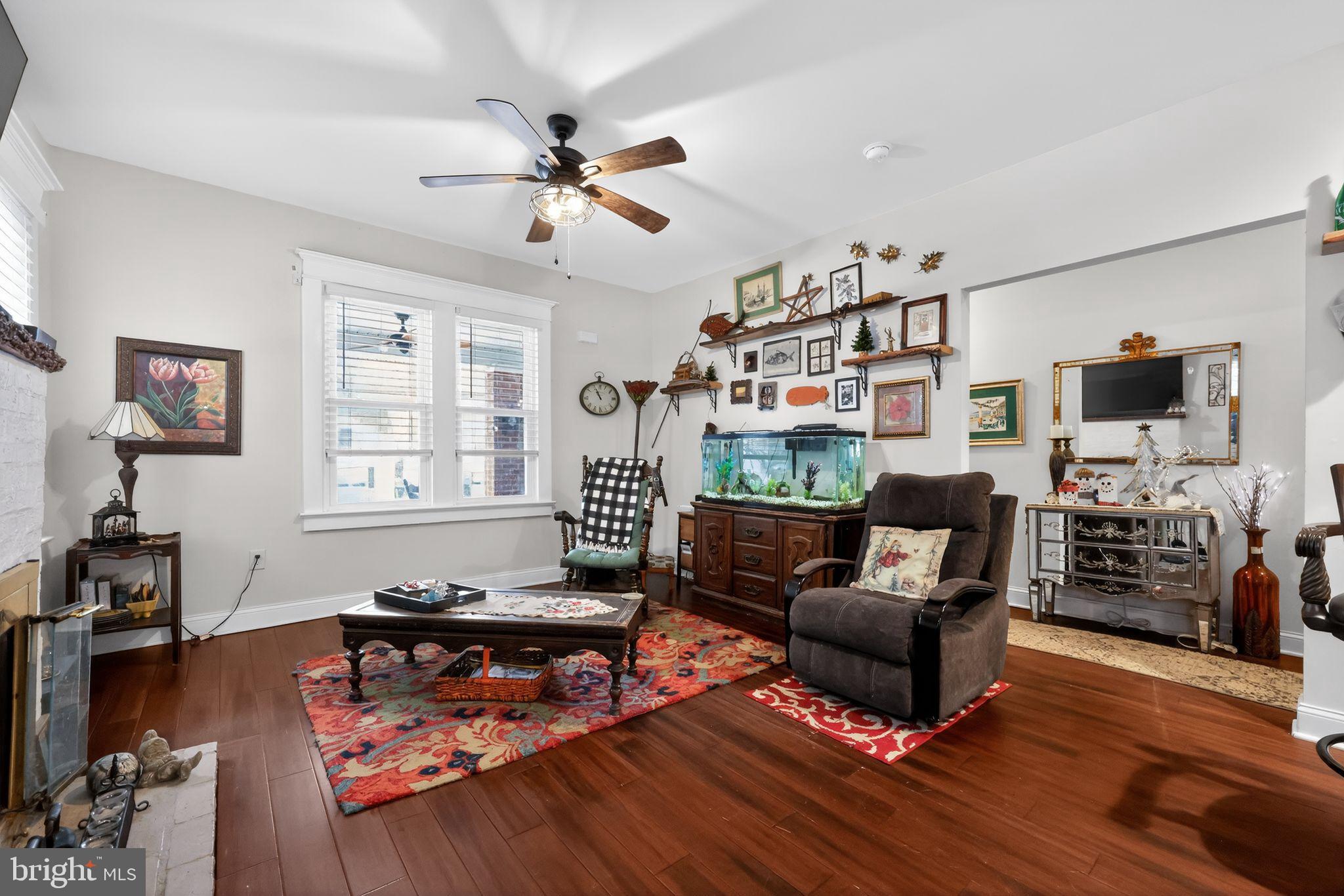 225 Rutland Avenue Mount Holly, NJ 08060 - Photo 8 of 30 a living room with furniture and a flat screen tv with wooden floor