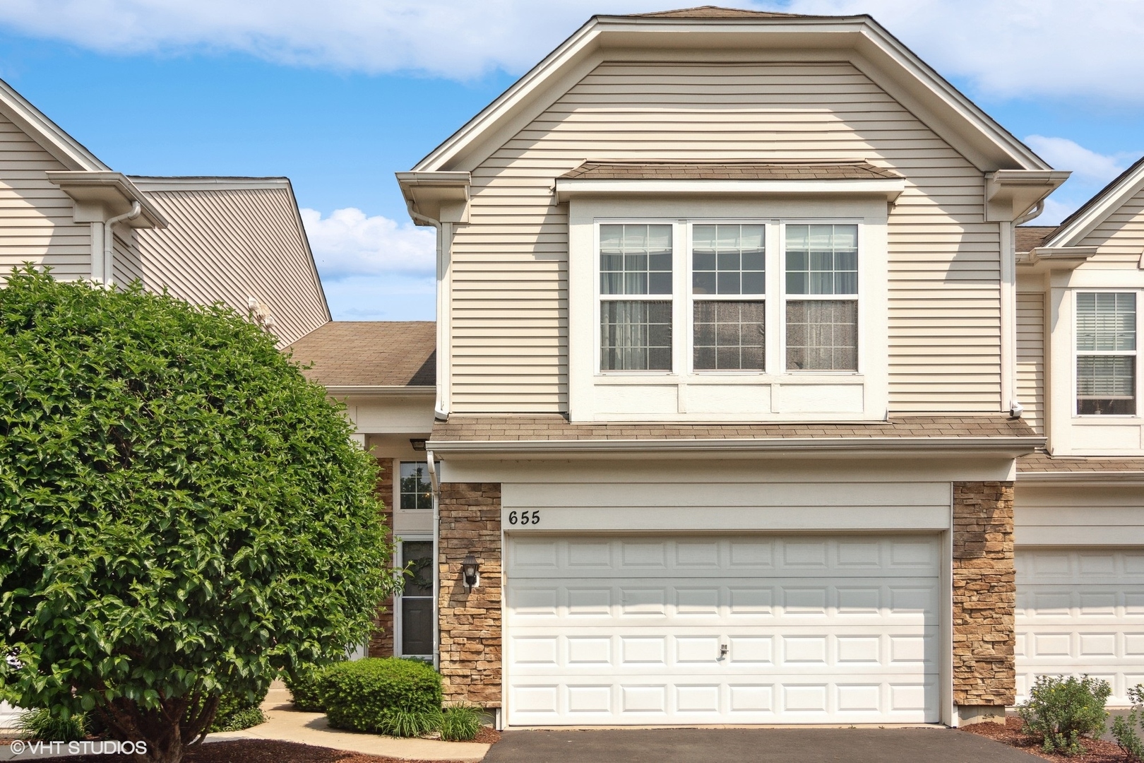 655 Pointe Drive Crystal Lake, IL 60014 - Photo 1 of 22 a view of a house with a window and door