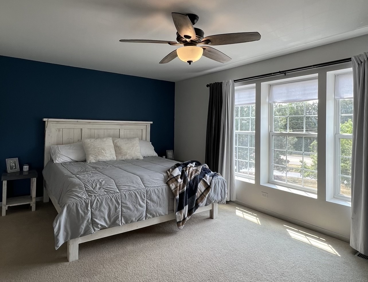 655 Pointe Drive Crystal Lake, IL 60014 - Photo 11 of 22 a bedroom with a bed and a large window