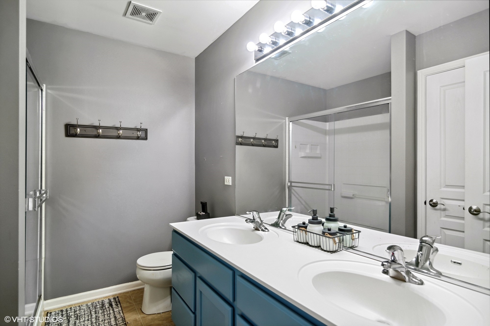 655 Pointe Drive Crystal Lake, IL 60014 - Photo 12 of 22 a bathroom with a sink toilet and shower