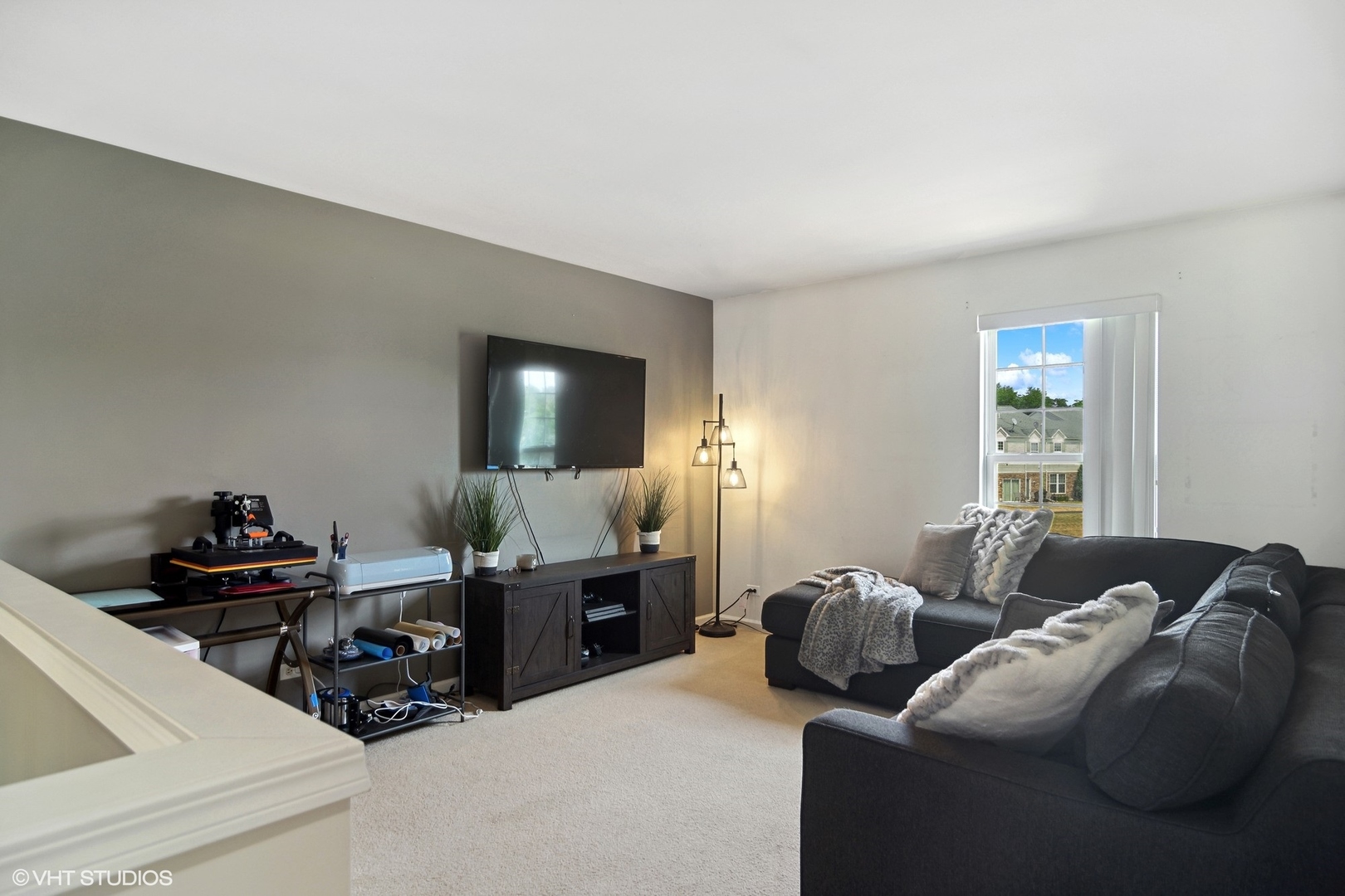 655 Pointe Drive Crystal Lake, IL 60014 - Photo 14 of 22 a living room with furniture and a flat screen tv