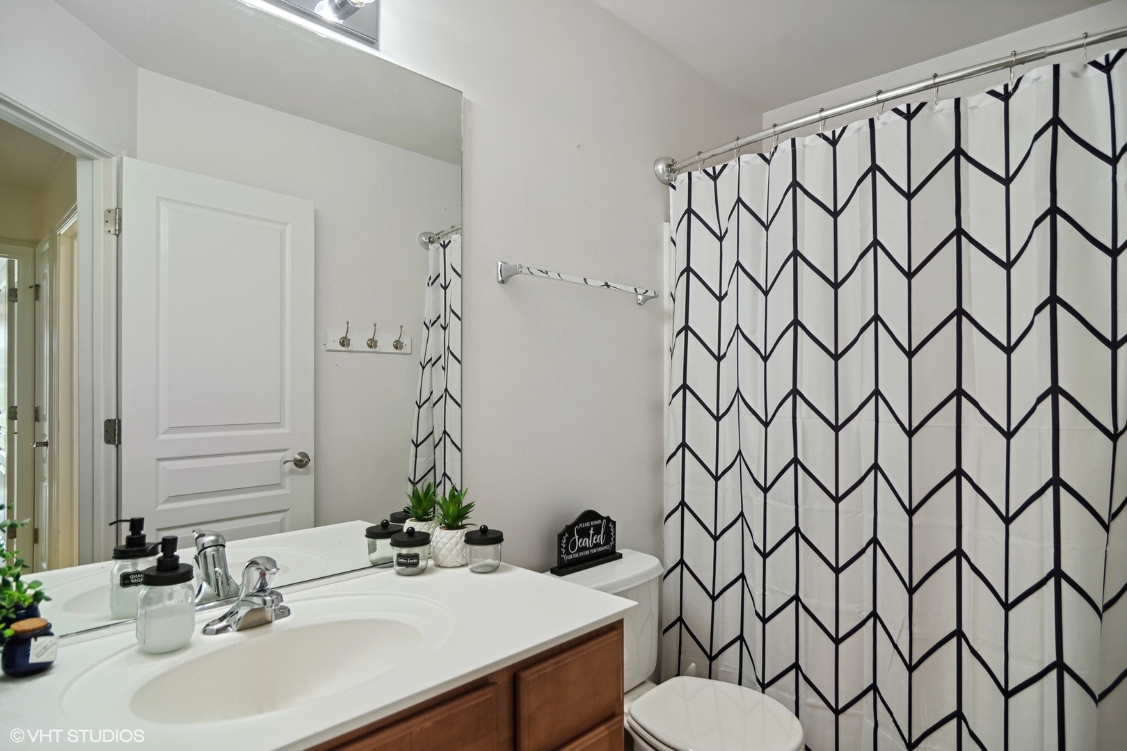 655 Pointe Drive Crystal Lake, IL 60014 - Photo 17 of 22 a bathroom with a sink a toilet and a mirror