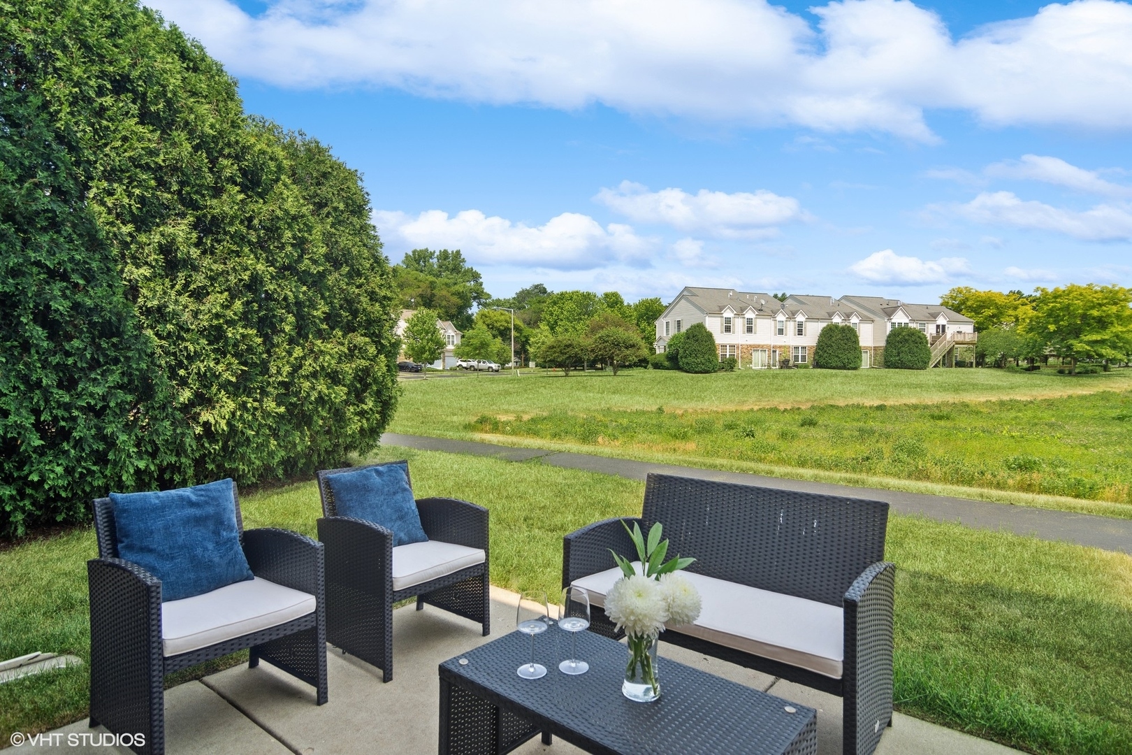 655 Pointe Drive Crystal Lake, IL 60014 - Photo 18 of 22 a view of a patio with lawn chairs and a table