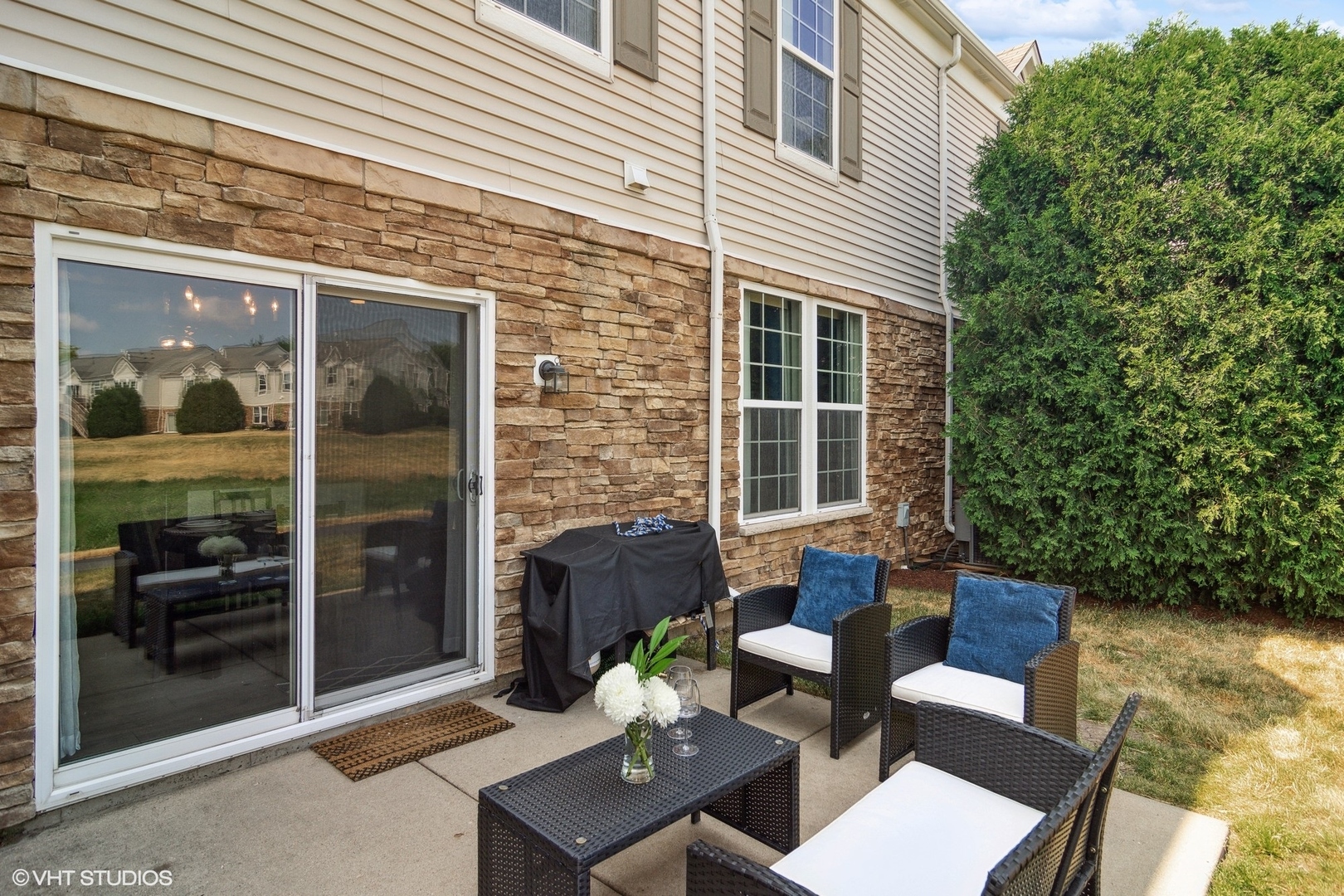 655 Pointe Drive Crystal Lake, IL 60014 - Photo 19 of 22 a view of a patio with couches table and chairs and potted plants