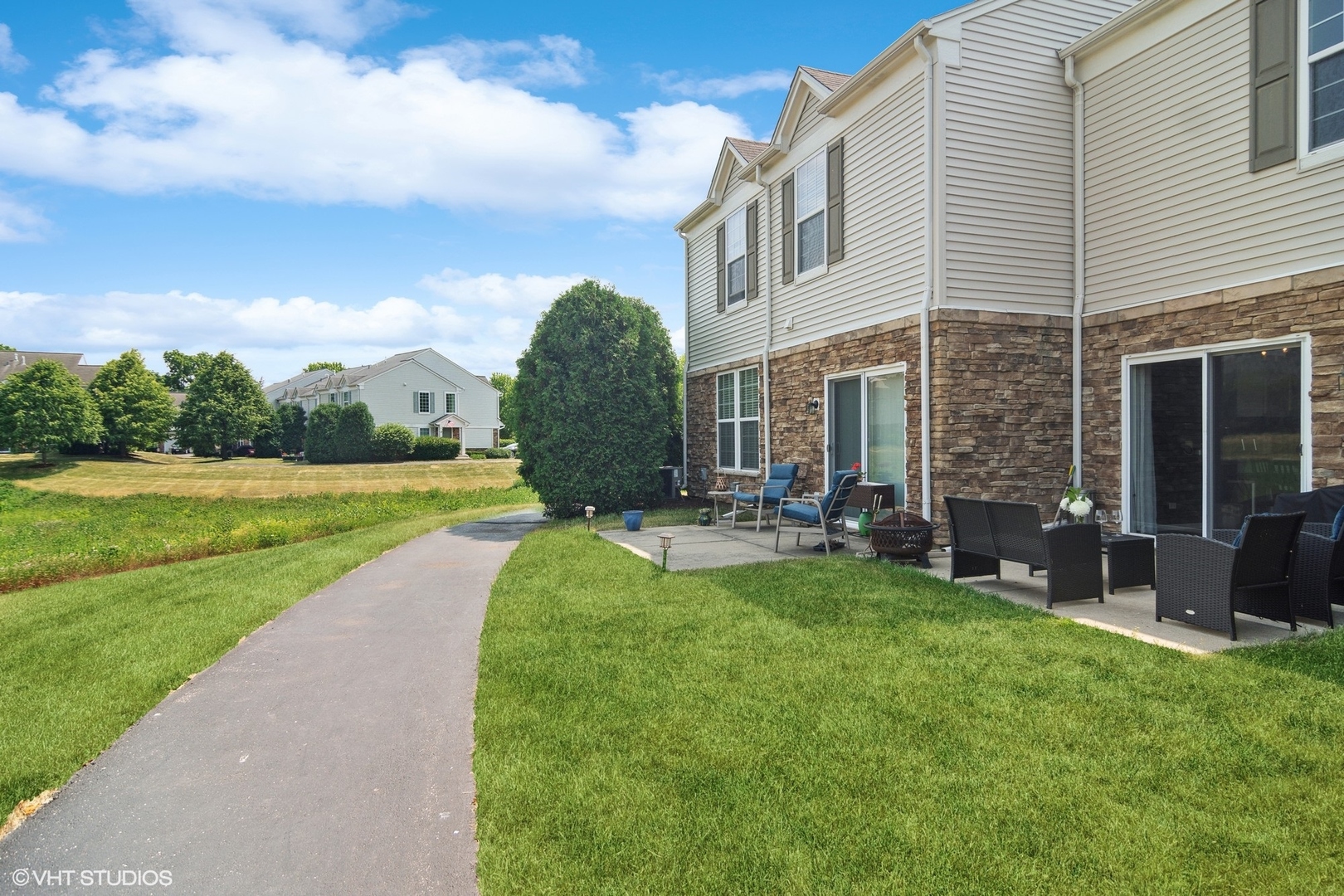 655 Pointe Drive Crystal Lake, IL 60014 - Photo 22 of 22 a view of a house with a yard and sitting area