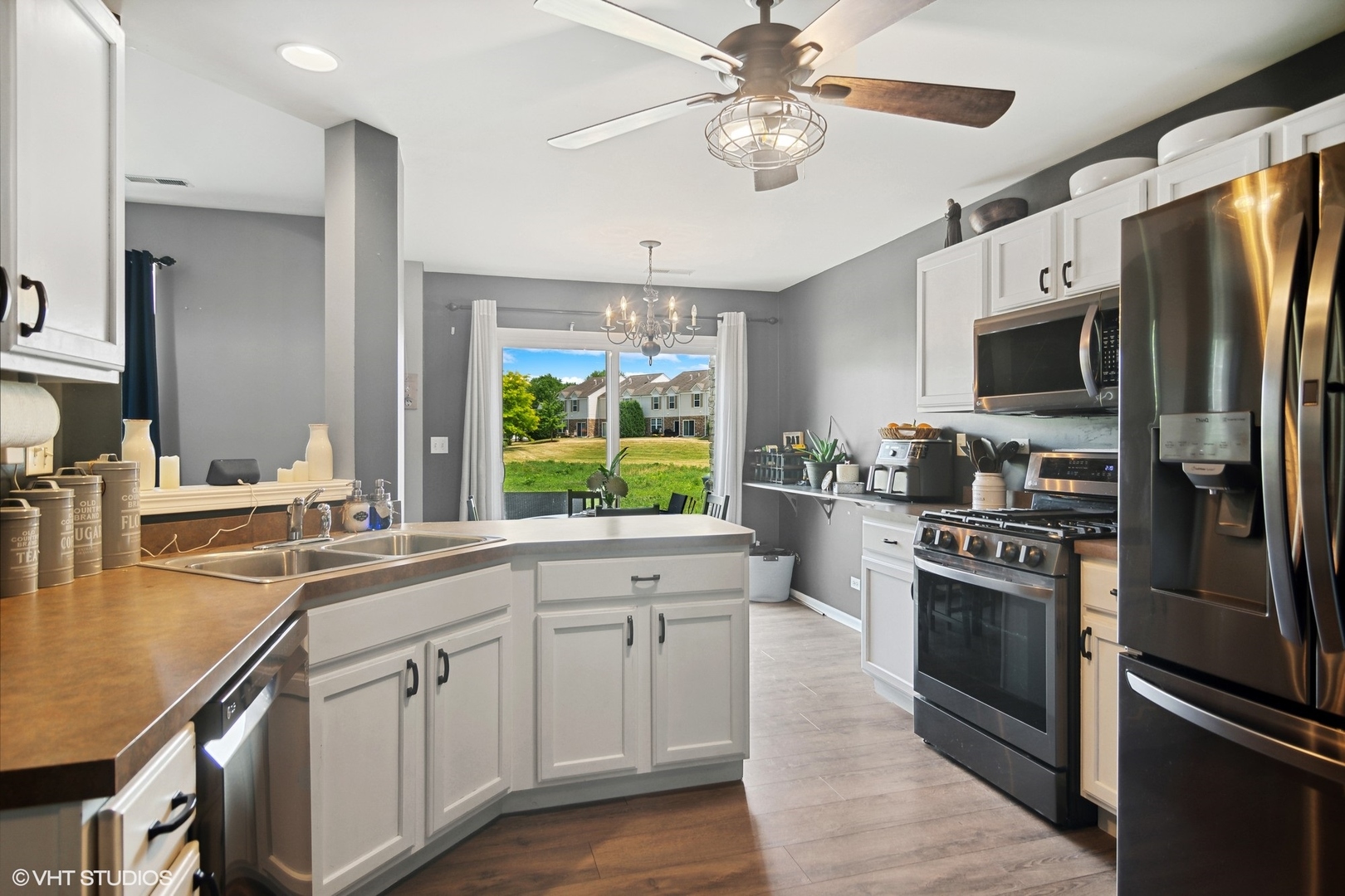 655 Pointe Drive Crystal Lake, IL 60014 - Photo 8 of 22 a kitchen with a sink stainless steel appliances and cabinets