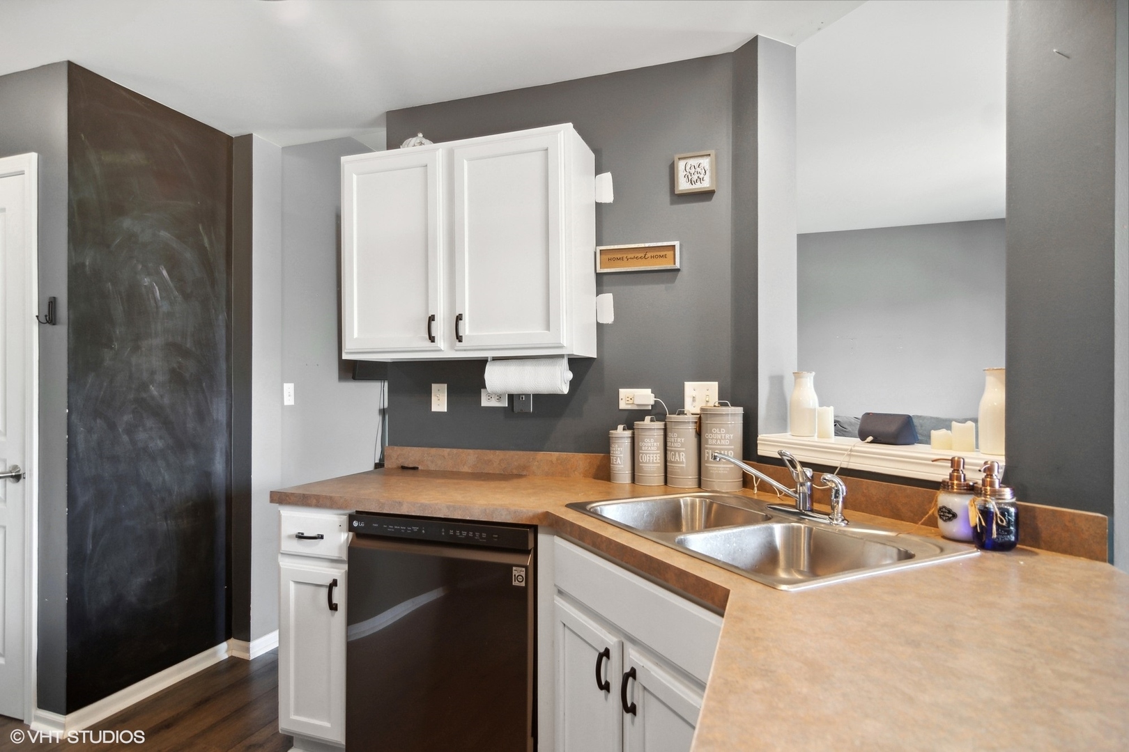 655 Pointe Drive Crystal Lake, IL 60014 - Photo 9 of 22 a kitchen with stainless steel appliances granite countertop a sink stove and cabinets