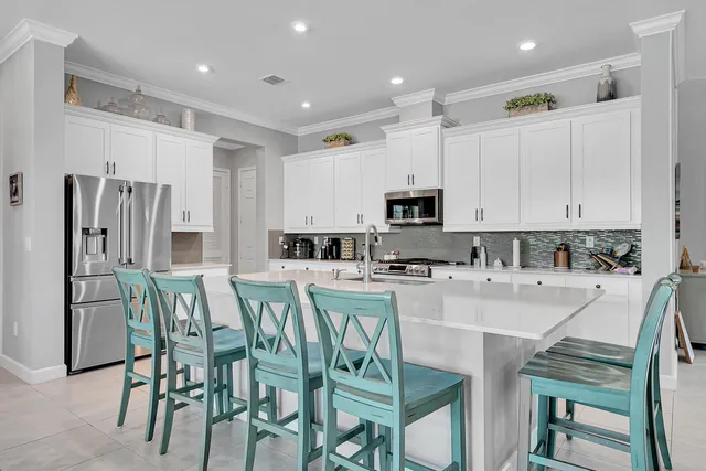 a livingroom with furniture floor to ceiling window and a flat screen tv
