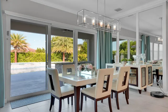 a spacious bedroom with a bed and lamp