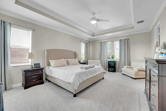 a bedroom with furniture and a window