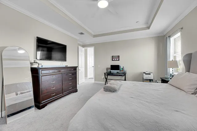 a bedroom with bed and a window