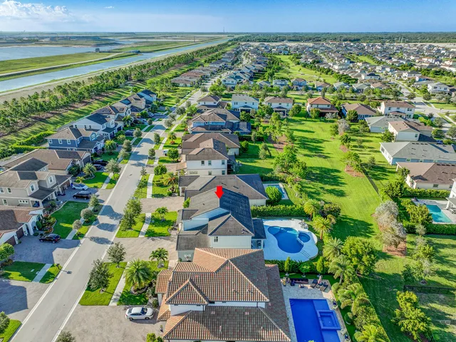 an aerial view of residential houses with outdoor space